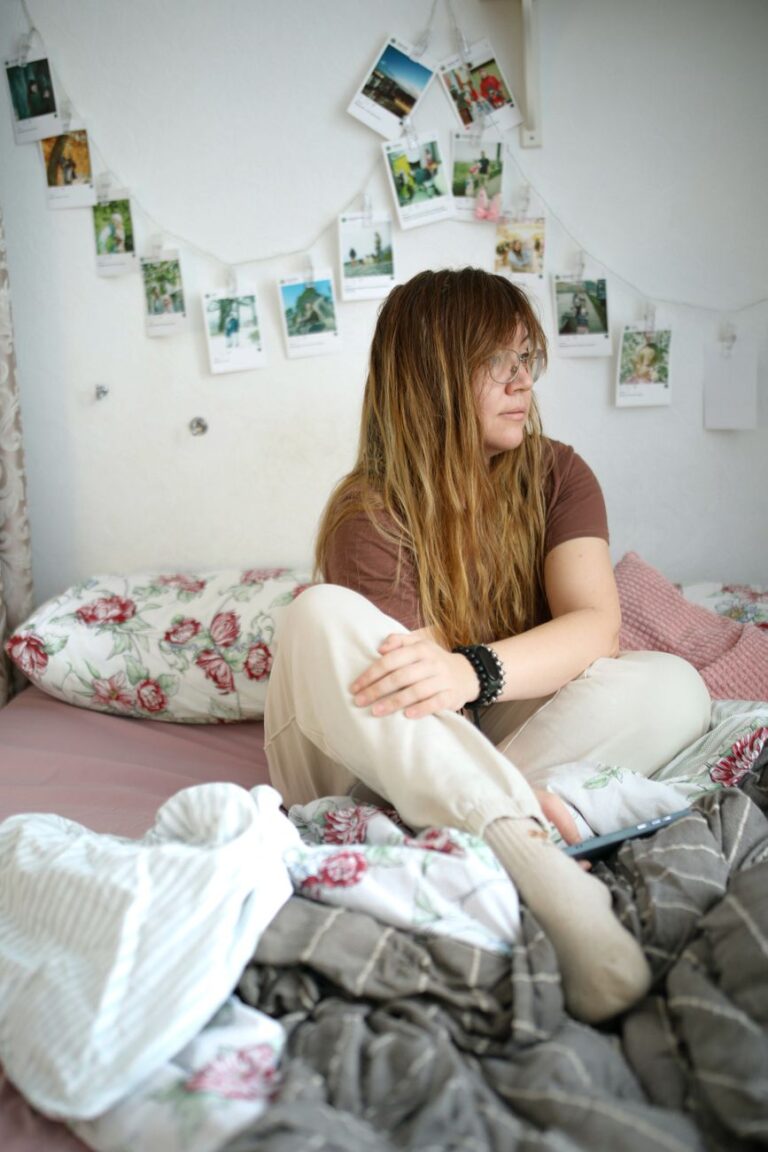 a woman sitting in a bed